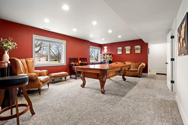 a bathroom with a sink vanity mirror and toilet