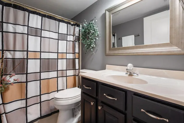 a living room with furniture pool table and a rug