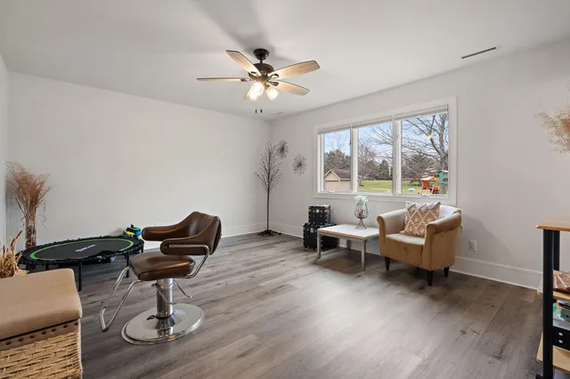 a bathroom with a toilet a sink and shower