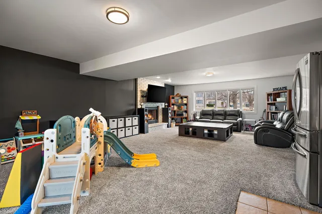 a view of a white house couches in backyard of house