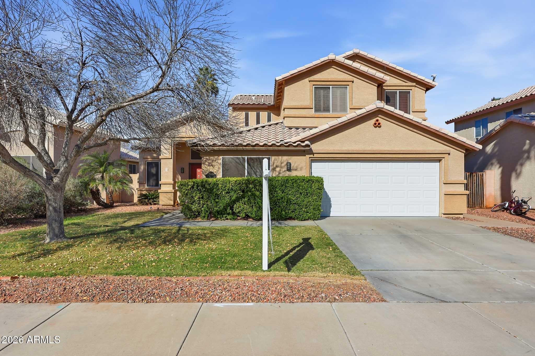 front view of a house with a yard