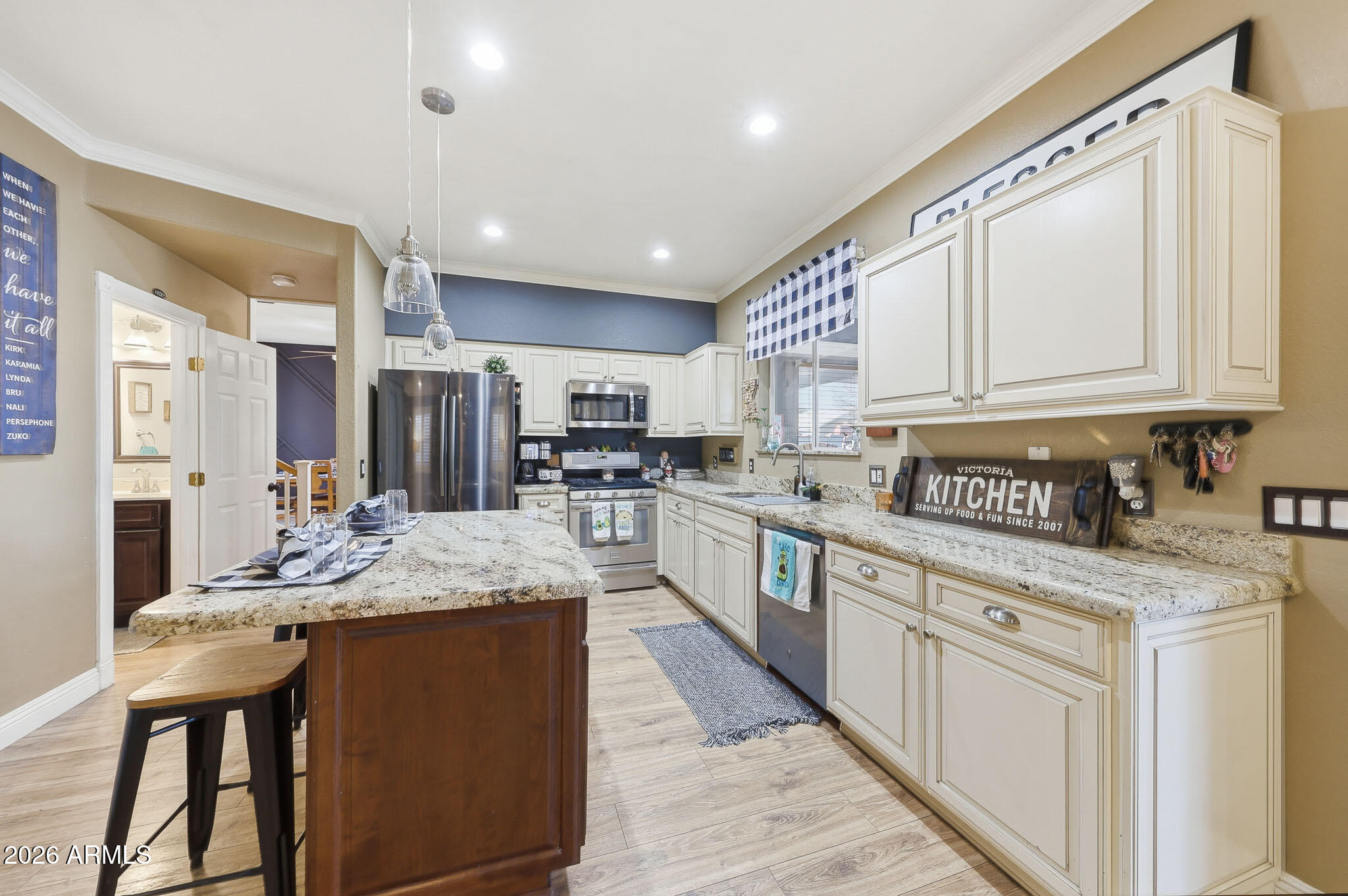 16248 West Hadley Street Goodyear, AZ 85338 - Photo 8 of 55 a kitchen with stainless steel appliances granite countertop a sink and cabinets