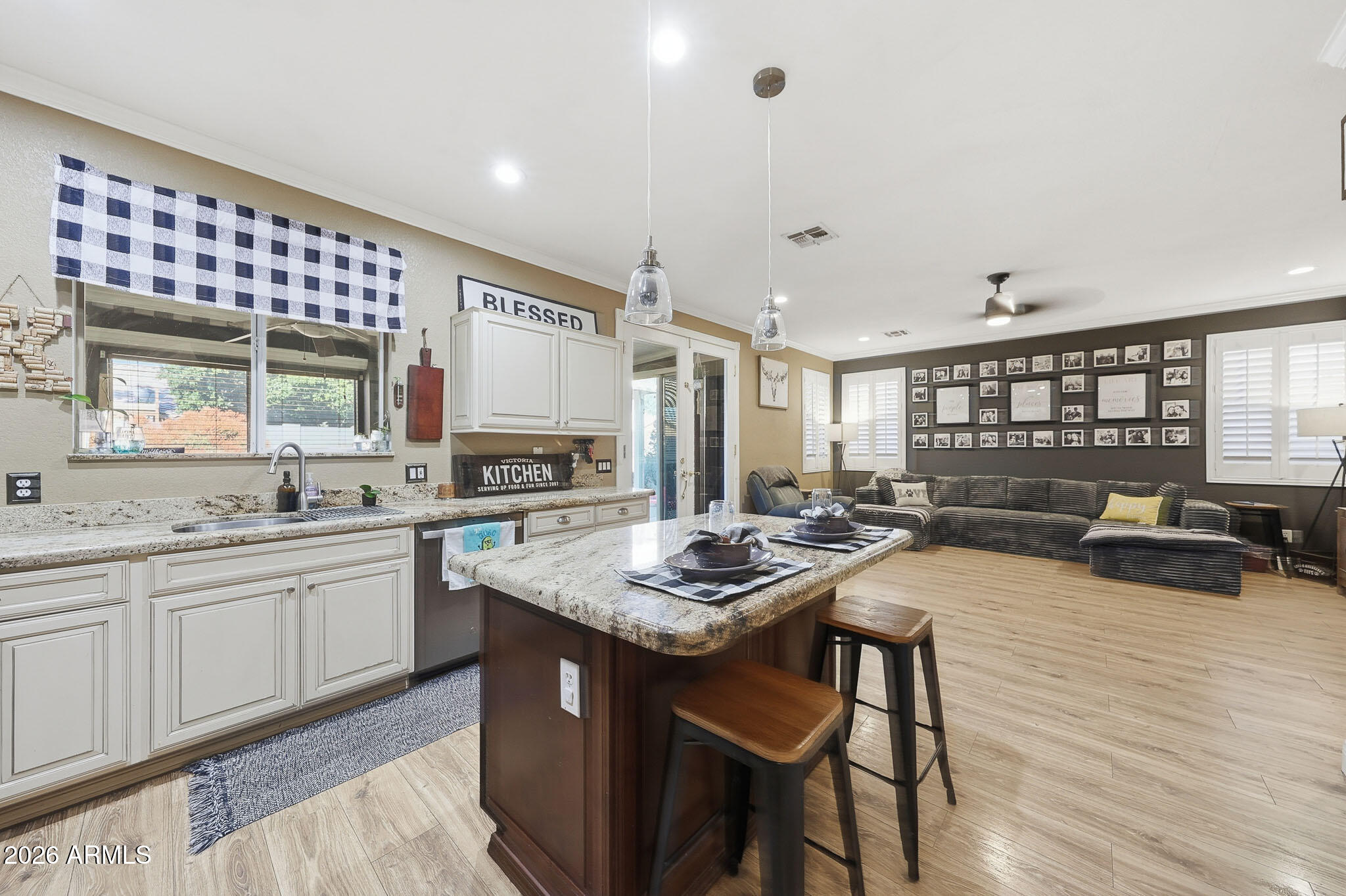 16248 West Hadley Street Goodyear, AZ 85338 - Photo 9 of 55 a kitchen with sink and view living room