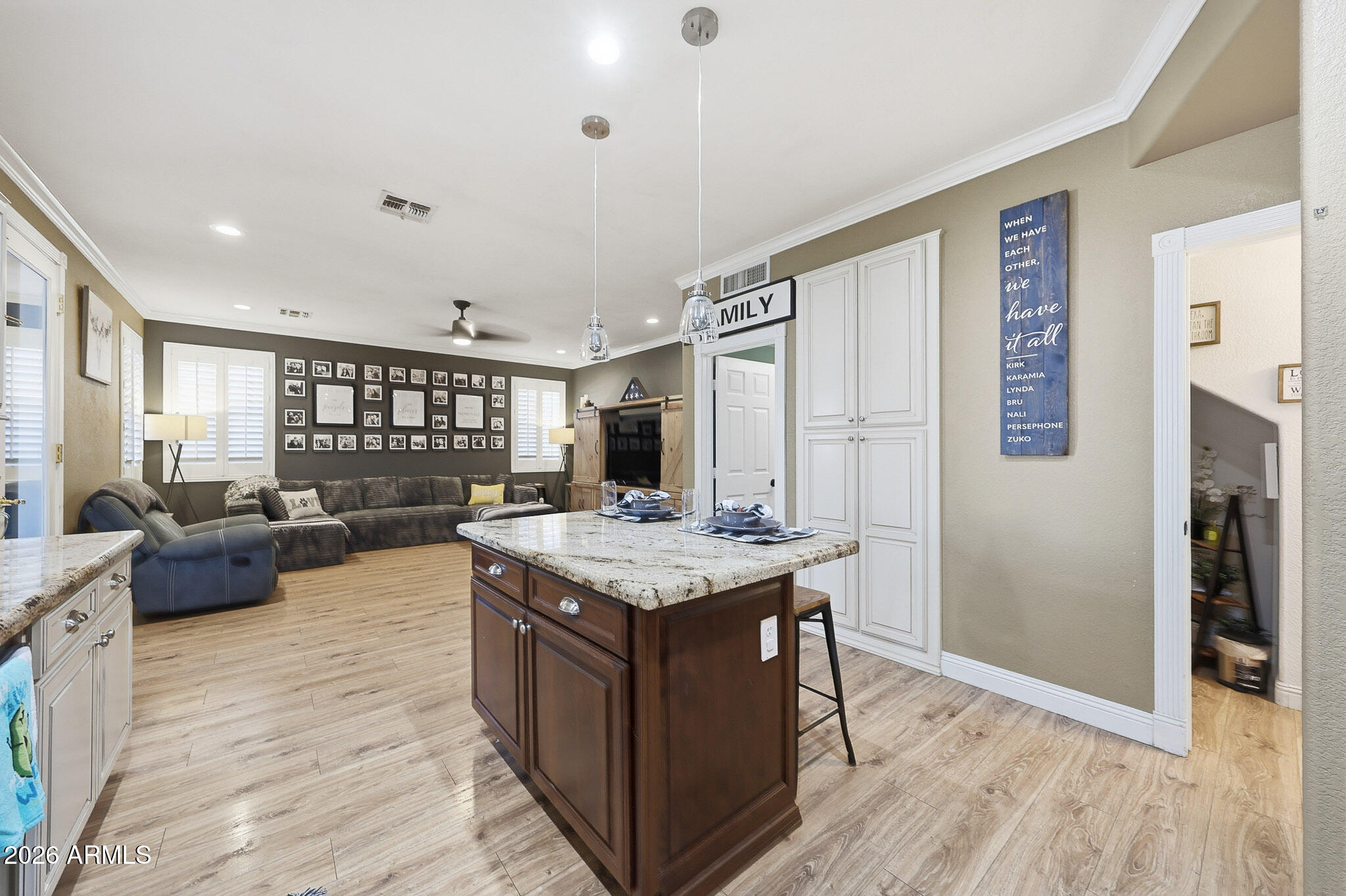 16248 West Hadley Street Goodyear, AZ 85338 - Photo 10 of 55 a kitchen with a stove and a refrigerator