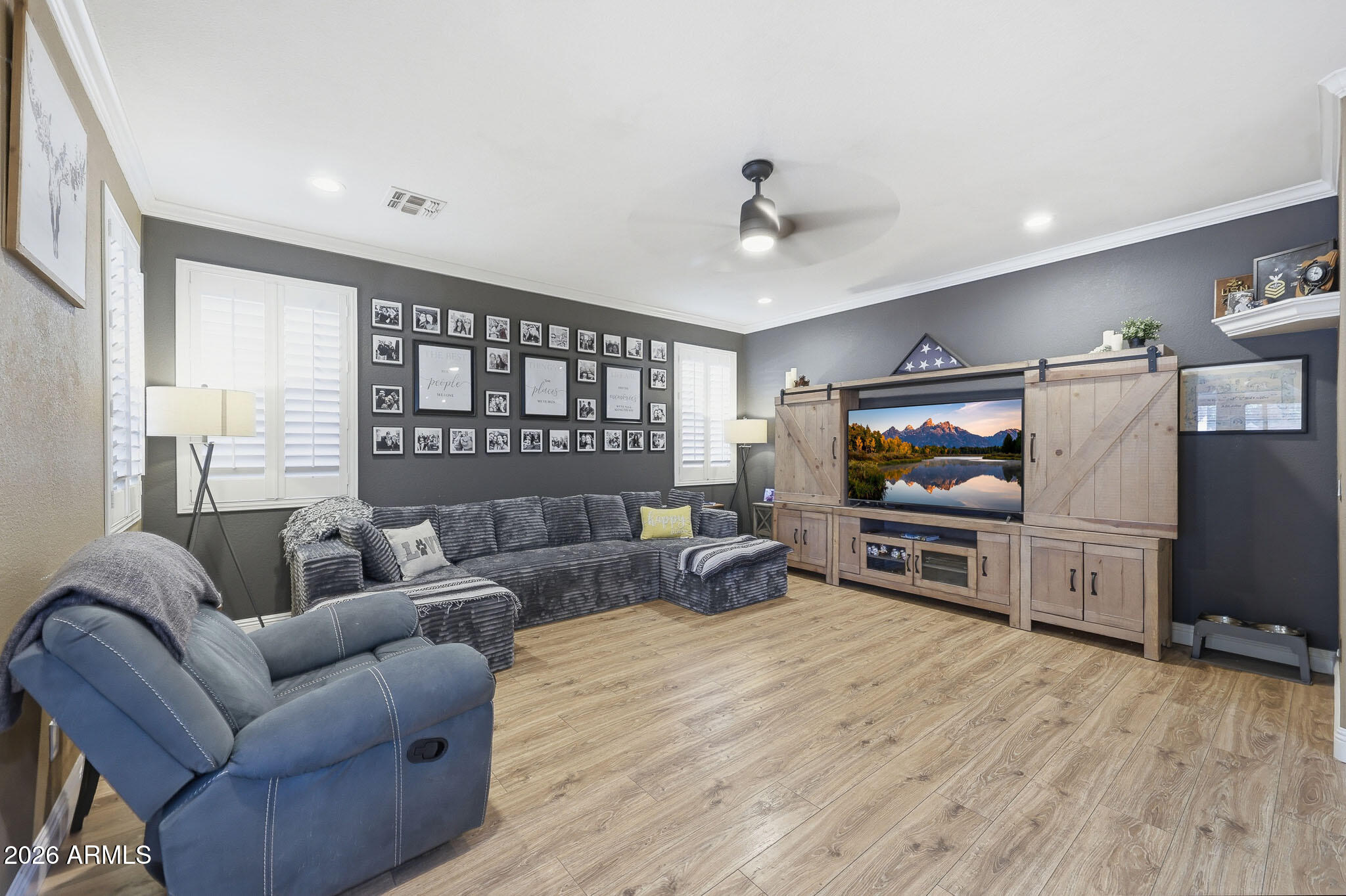 16248 West Hadley Street Goodyear, AZ 85338 - Photo 14 of 55 a living room with furniture and a flat screen tv