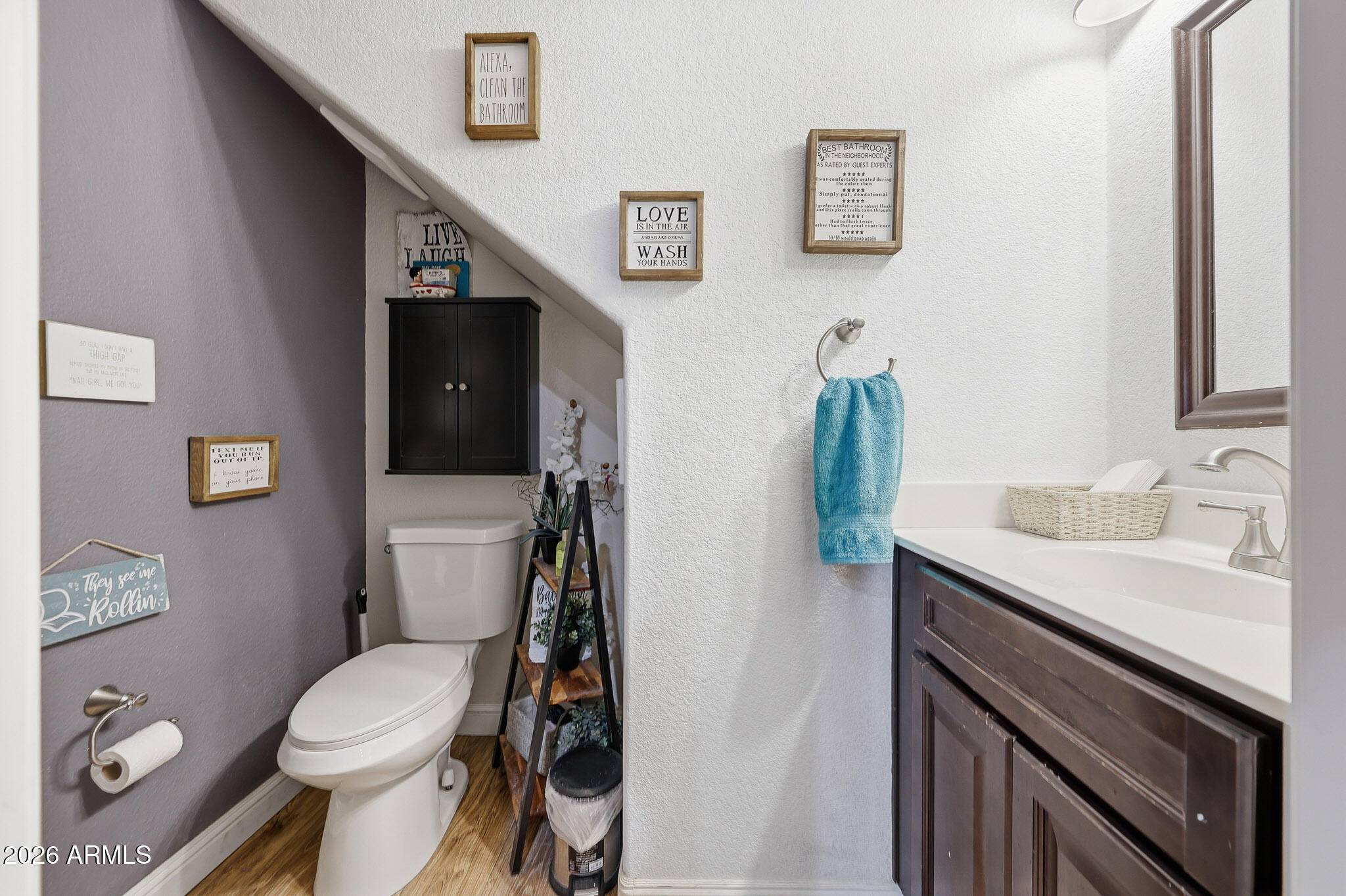 16248 West Hadley Street Goodyear, AZ 85338 - Photo 18 of 55 a bathroom with a granite countertop toilet sink and mirror