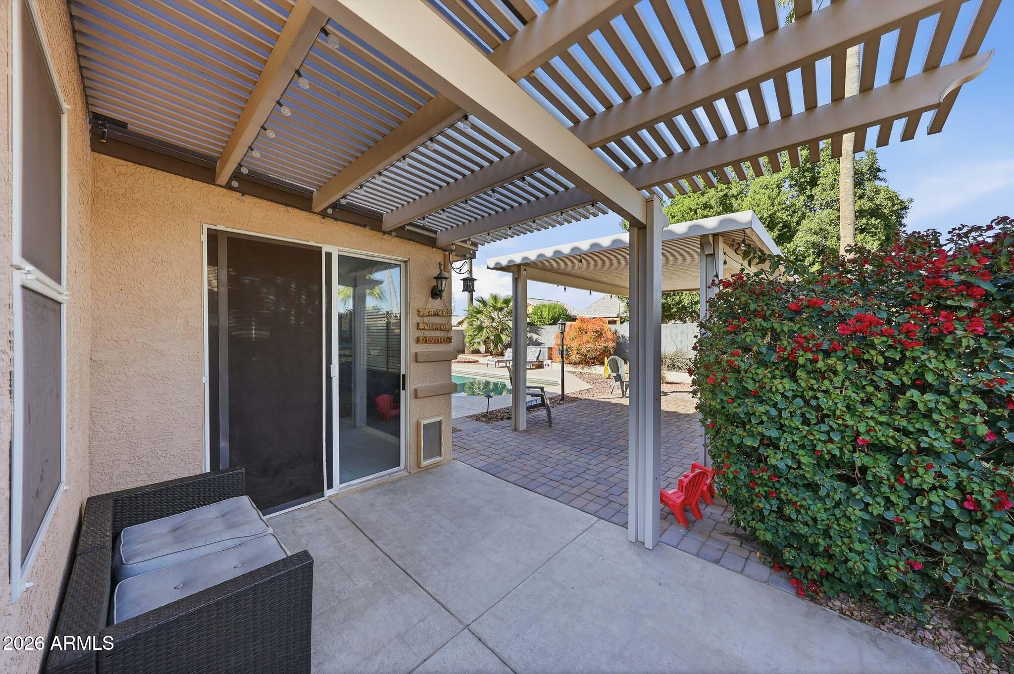 16248 West Hadley Street Goodyear, AZ 85338 - Photo 20 of 55 a living room with furniture and a flower garden