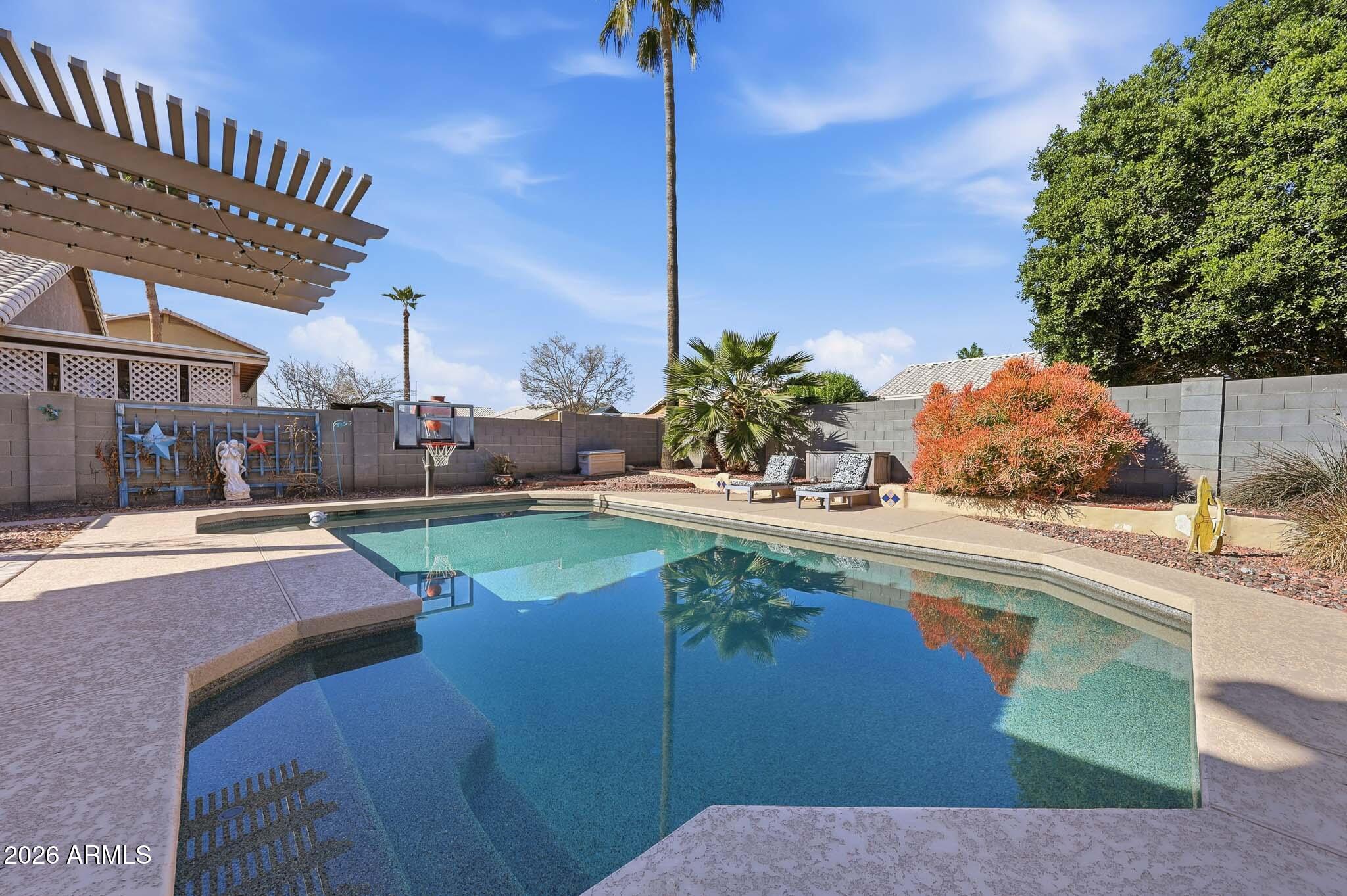 16248 West Hadley Street Goodyear, AZ 85338 - Photo 26 of 55 a view of a swimming pool with a patio