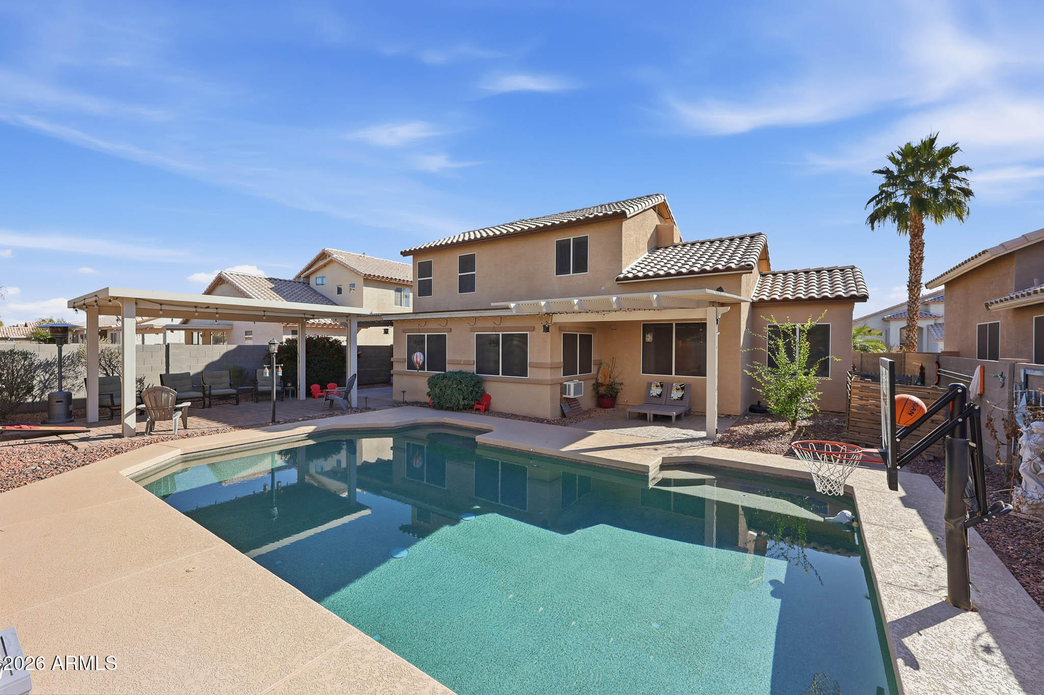 16248 West Hadley Street Goodyear, AZ 85338 - Photo 28 of 55 a view of a house with swimming pool and sitting area