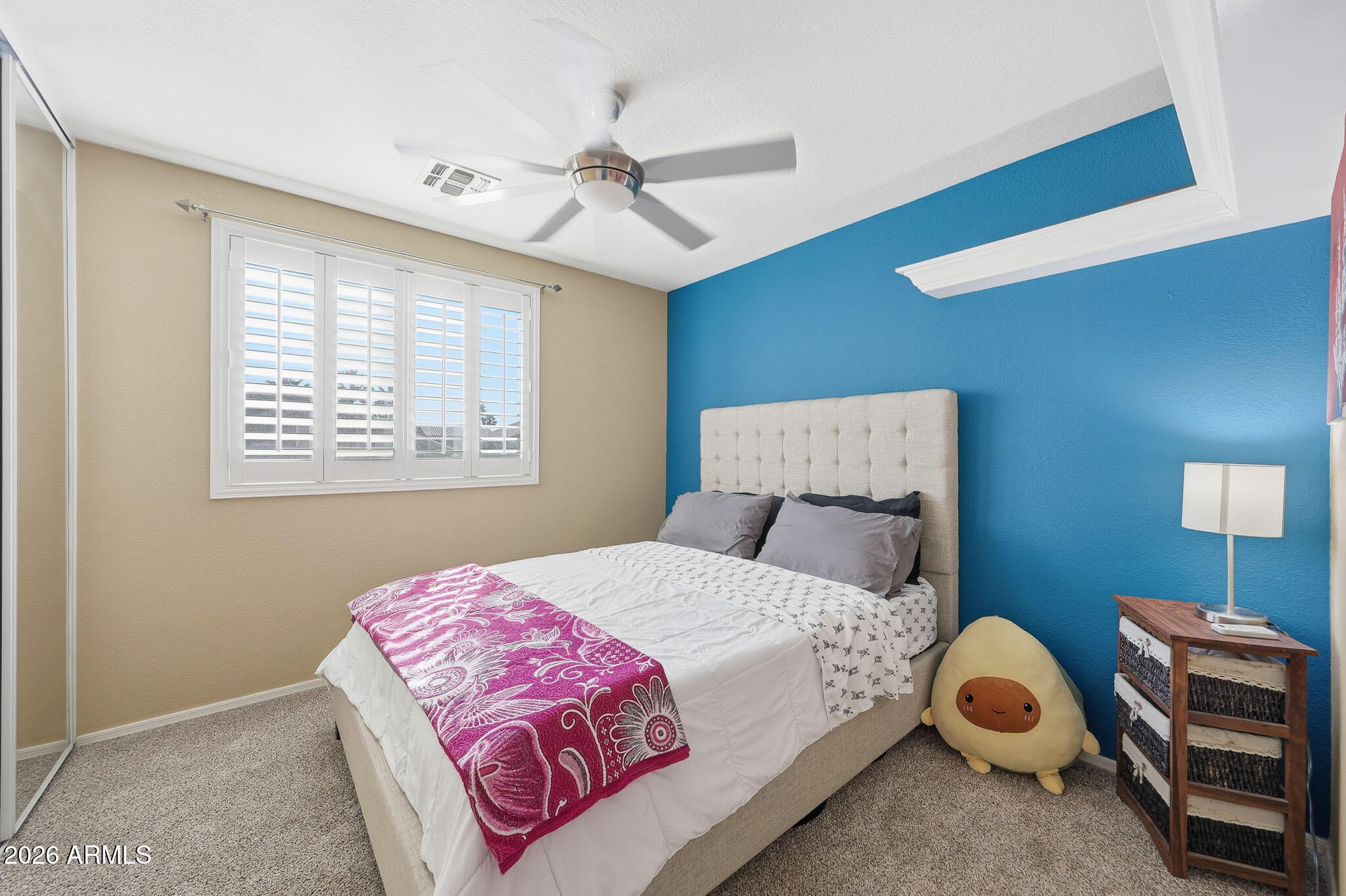 16248 West Hadley Street Goodyear, AZ 85338 - Photo 32 of 55 a bedroom with a bed and a window
