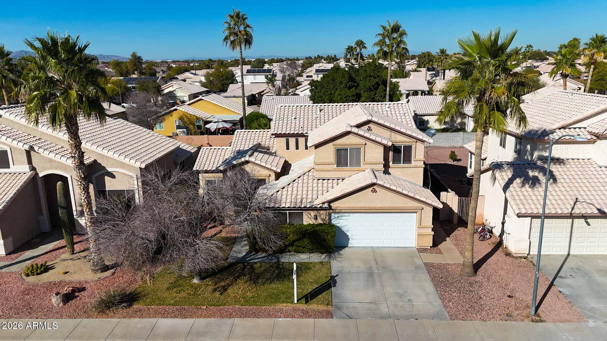 16248 West Hadley Street Goodyear, AZ 85338 - Photo 44 of 55 a view of multiple houses with yard