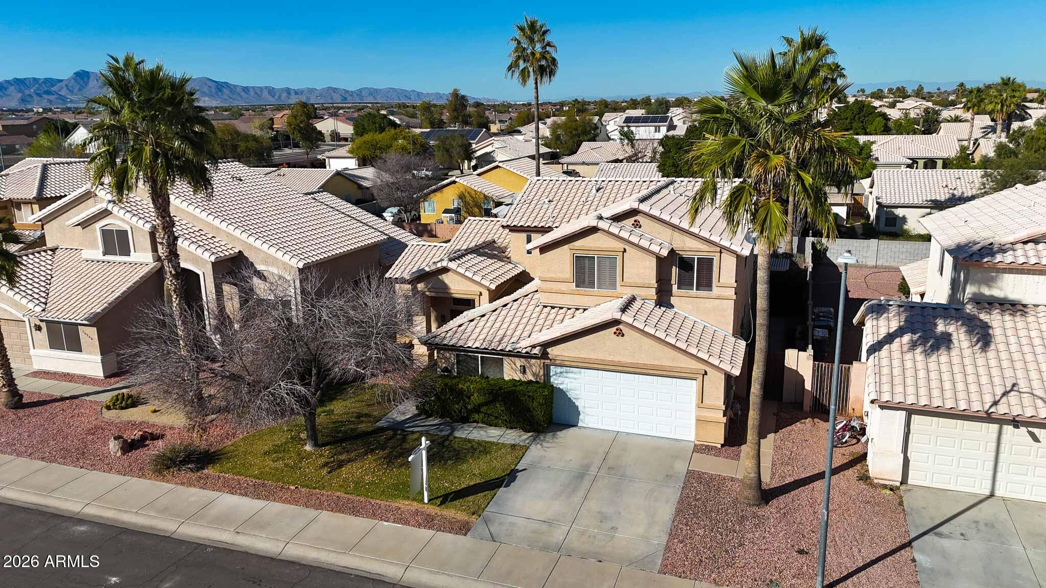 16248 West Hadley Street Goodyear, AZ 85338 - Photo 45 of 55 an aerial view of a house with a yard and fountain