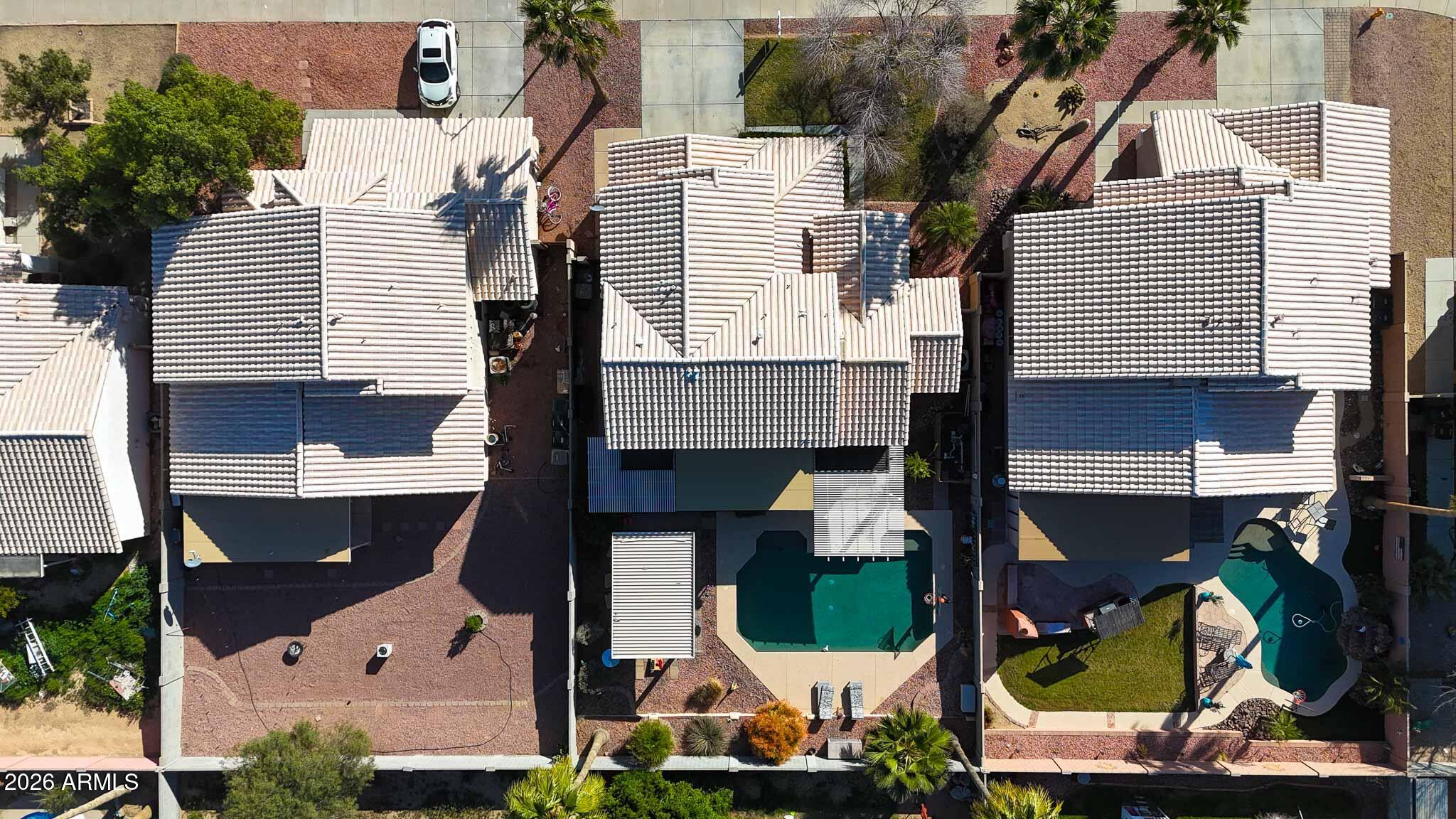 16248 West Hadley Street Goodyear, AZ 85338 - Photo 48 of 55 an aerial view of a house with a swimming pool