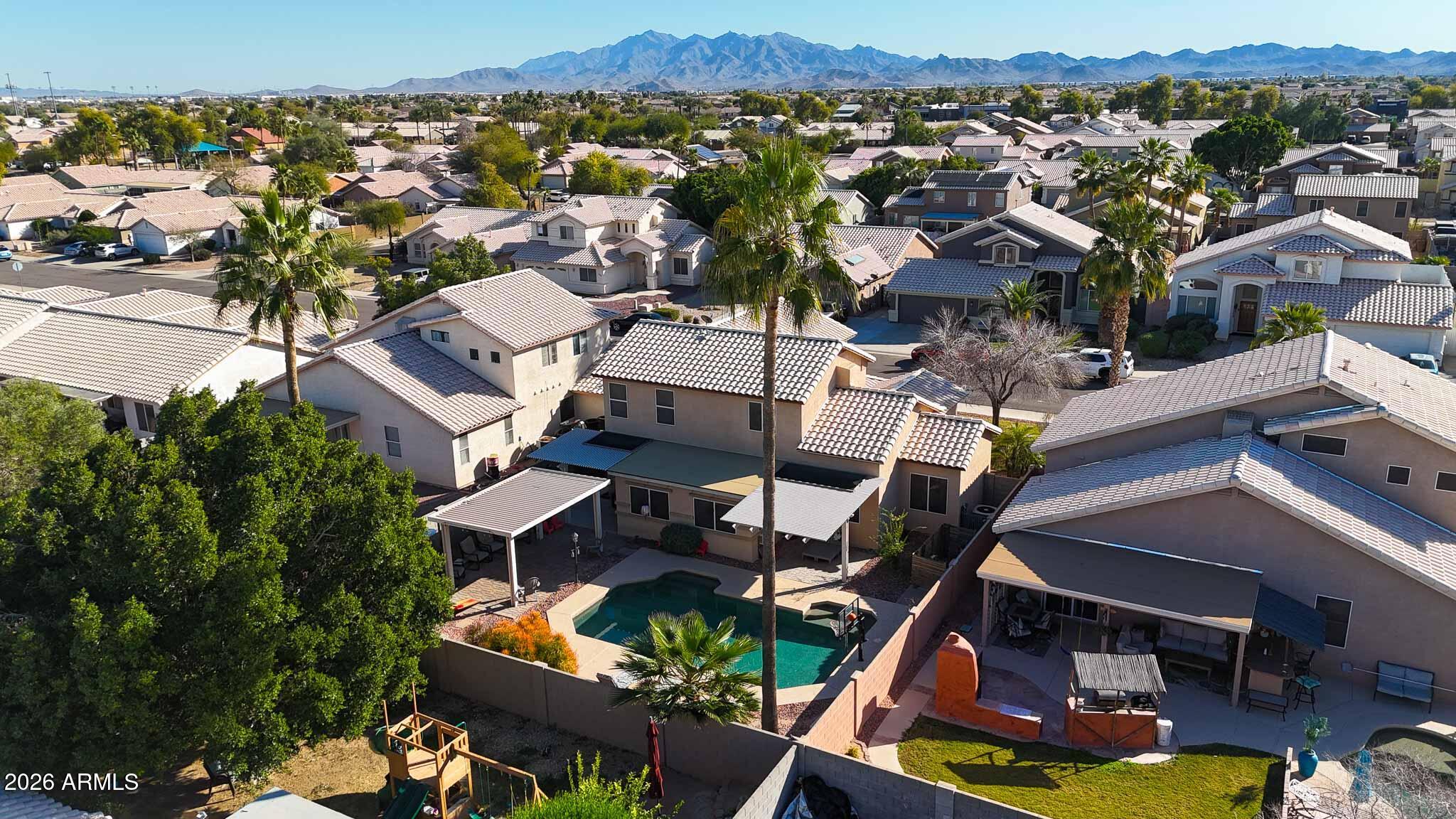 16248 West Hadley Street Goodyear, AZ 85338 - Photo 49 of 55 an aerial view of multiple houses with yard