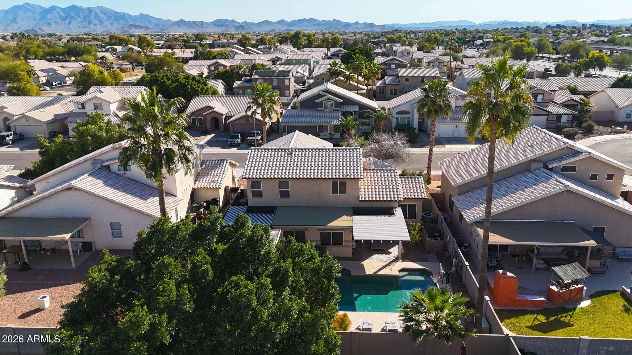 16248 West Hadley Street Goodyear, AZ 85338 - Photo 50 of 55 an aerial view of residential houses with outdoor space and parking