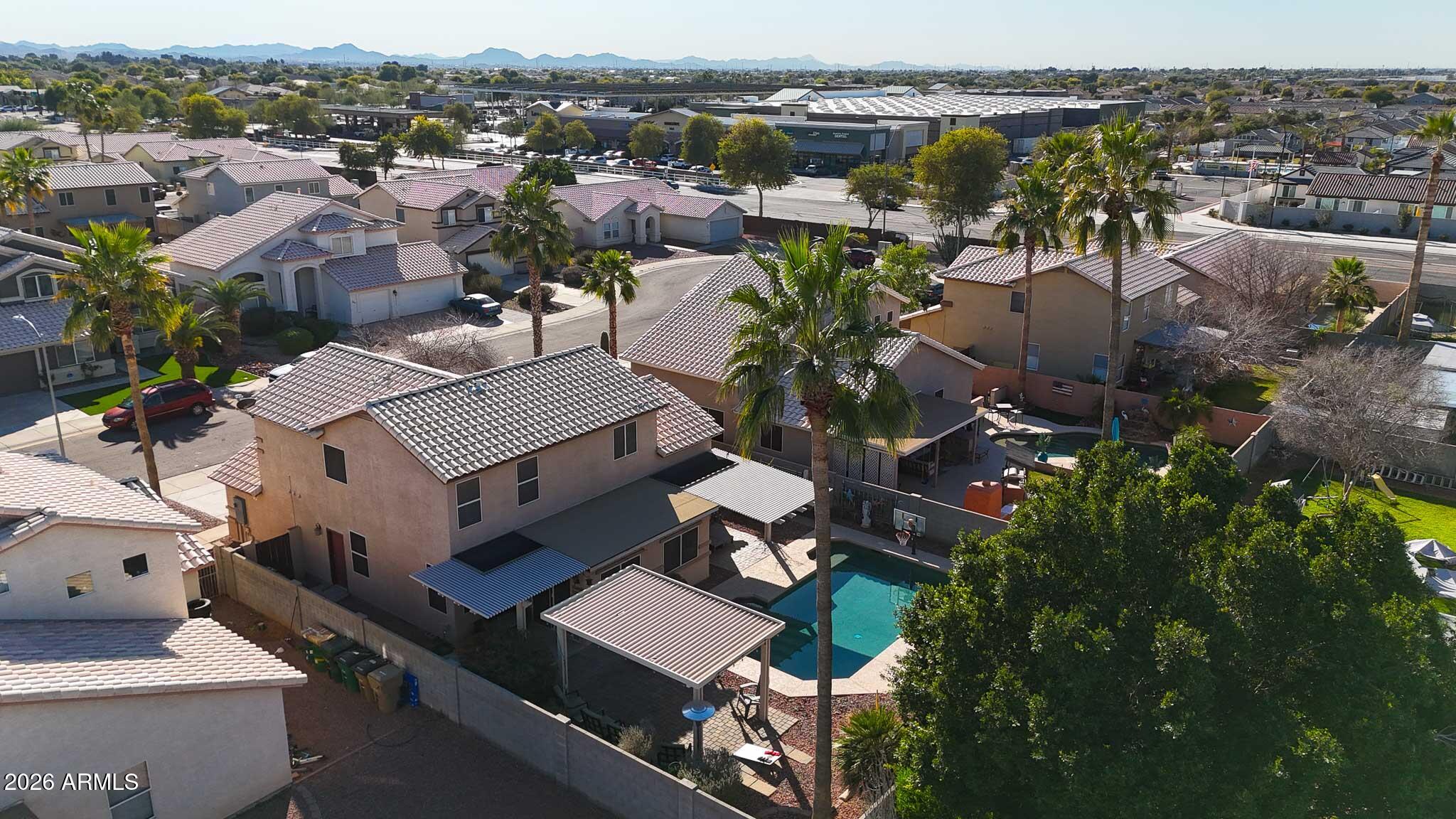 16248 West Hadley Street Goodyear, AZ 85338 - Photo 52 of 55 an aerial view of multiple houses with yard