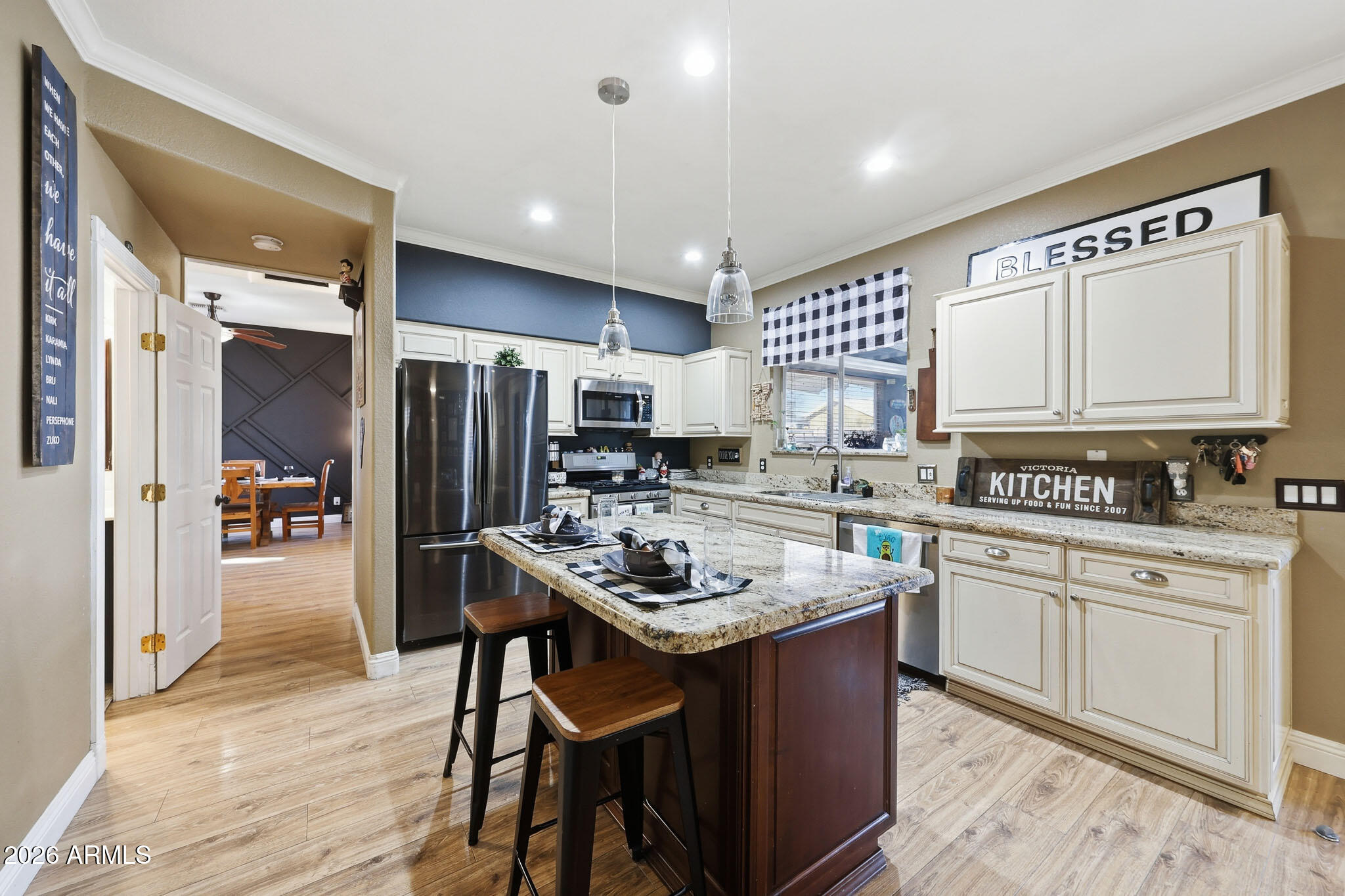 16248 West Hadley Street Goodyear, AZ 85338 - Photo 7 of 55 a kitchen with a sink stove and refrigerator