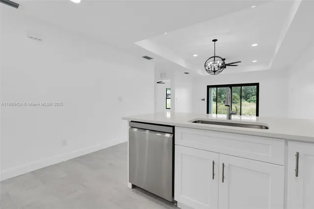 a kitchen with a sink and window