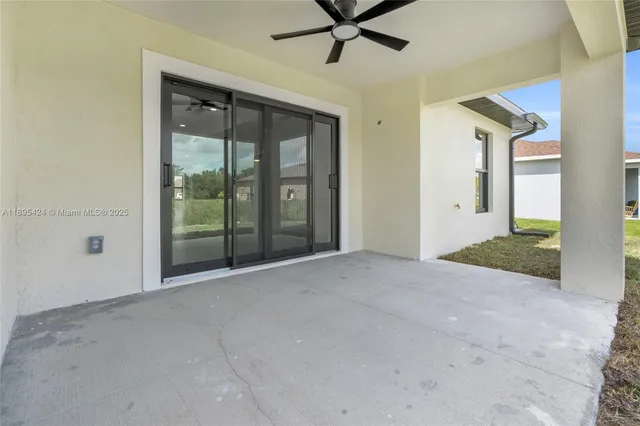 a view of a room with a ceiling fan
