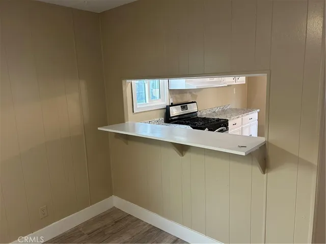 a room with a sink and cabinets