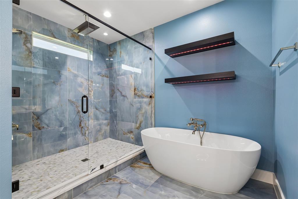 1053 Sedalia Road Van Alstyne, TX 75495 - Photo 29 of 40 a bathroom with a bathtub and shower