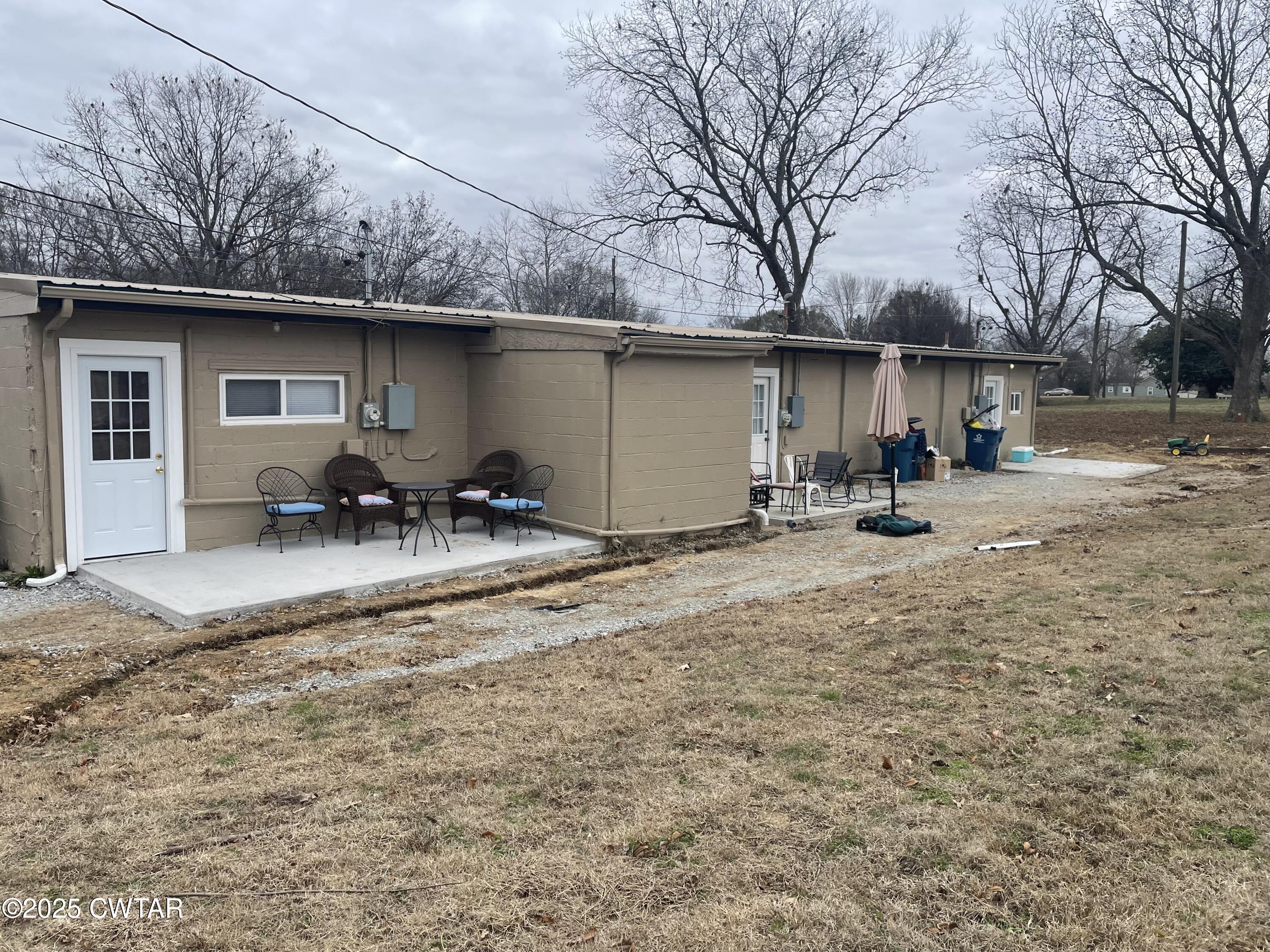 113 North West Street Rutherford, TN 38369 - Photo 12 of 16 a backyard of a house with table and chairs