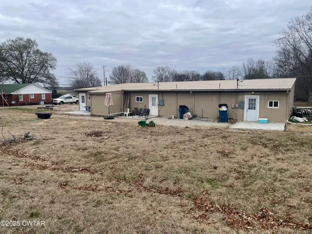 a view of a house with a big yard