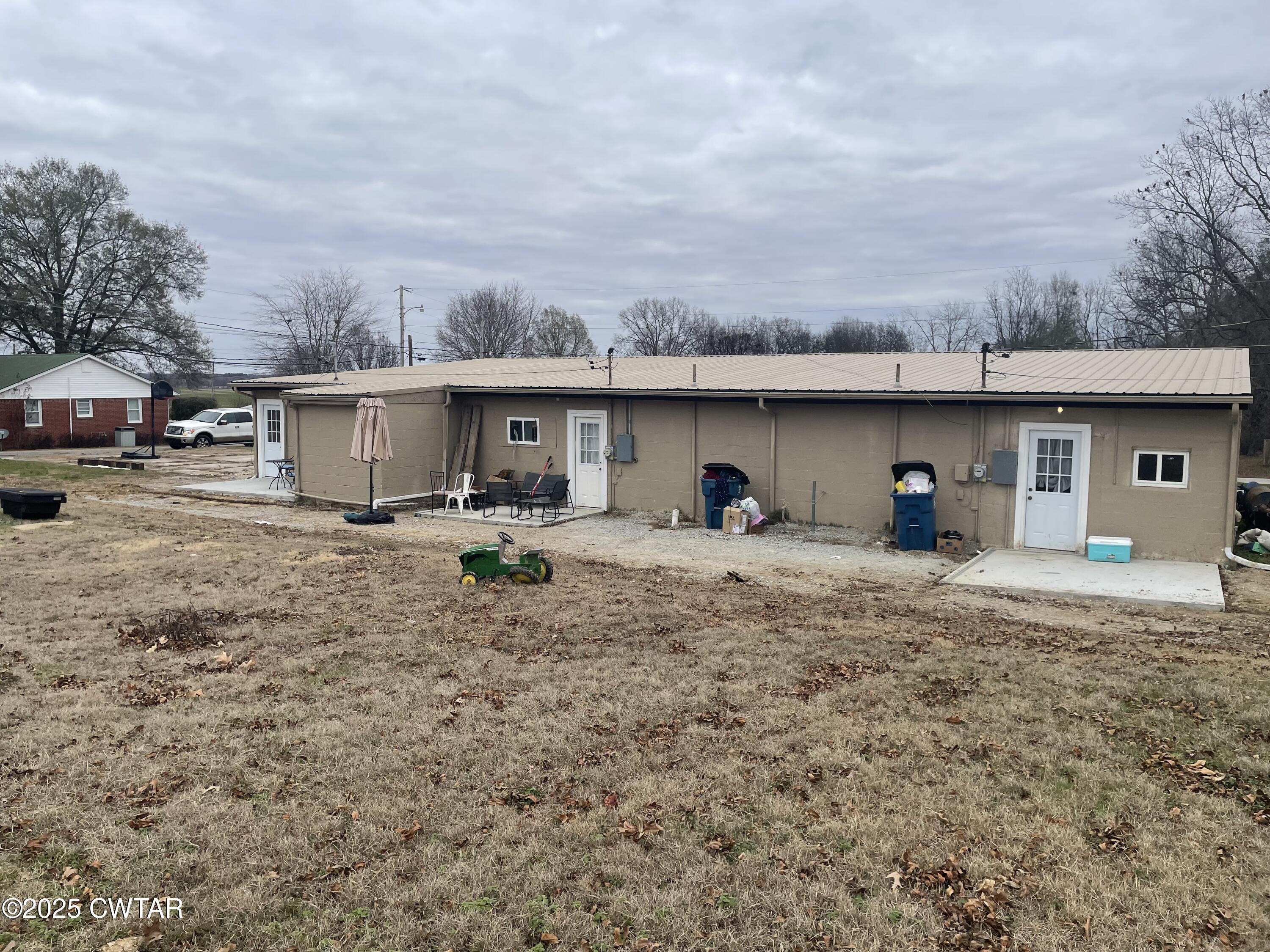 113 North West Street Rutherford, TN 38369 - Photo 14 of 16 a view of a house with backyard and a car parked in front of it