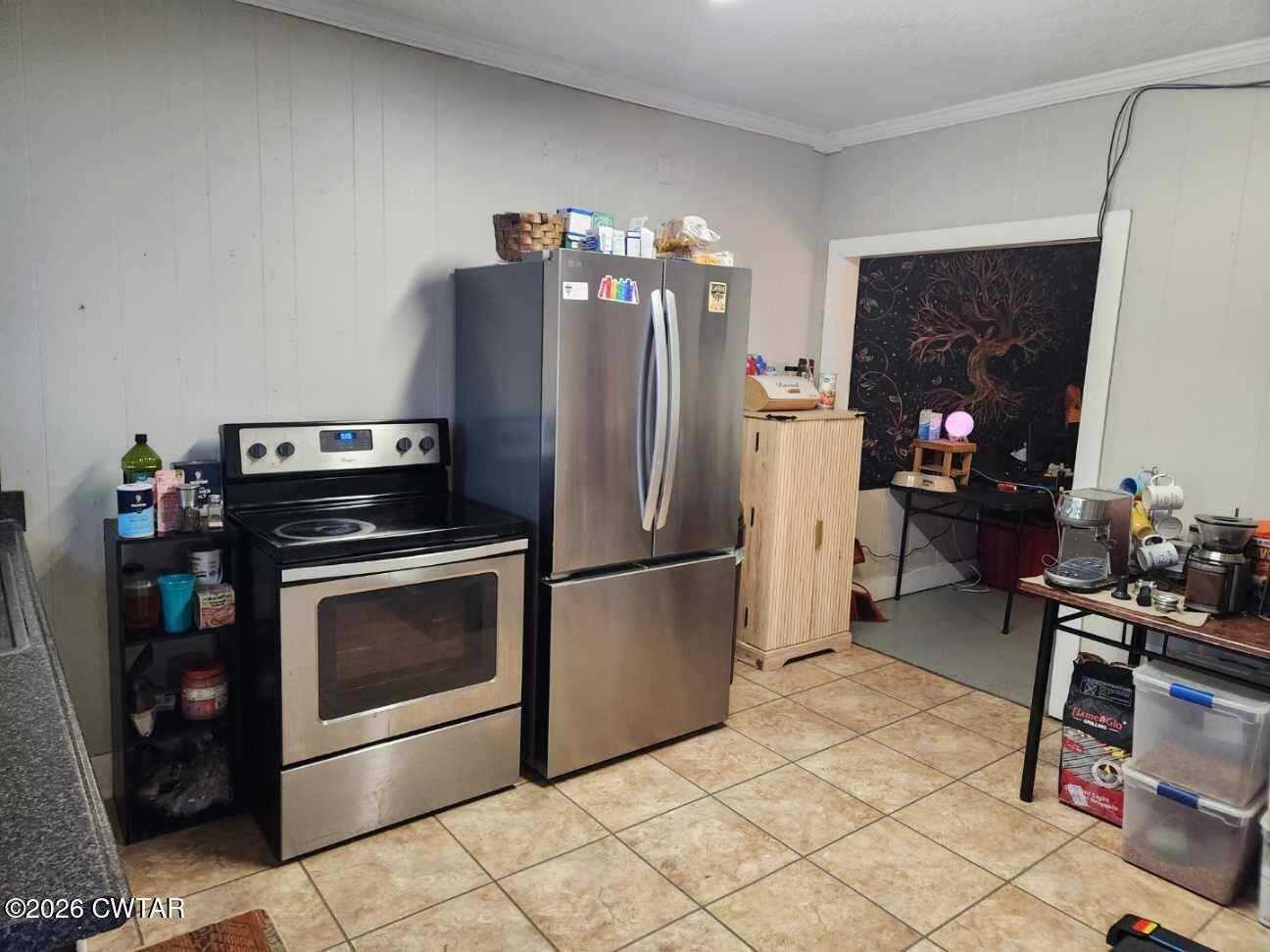 113 North West Street Rutherford, TN 38369 - Photo 19 of 24 a kitchen with a refrigerator and a stove top oven