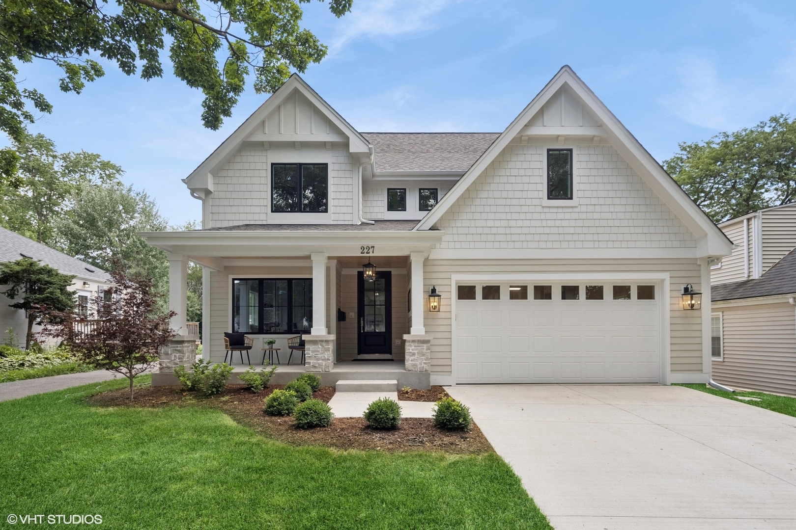 a view of house with yard and front view of a house