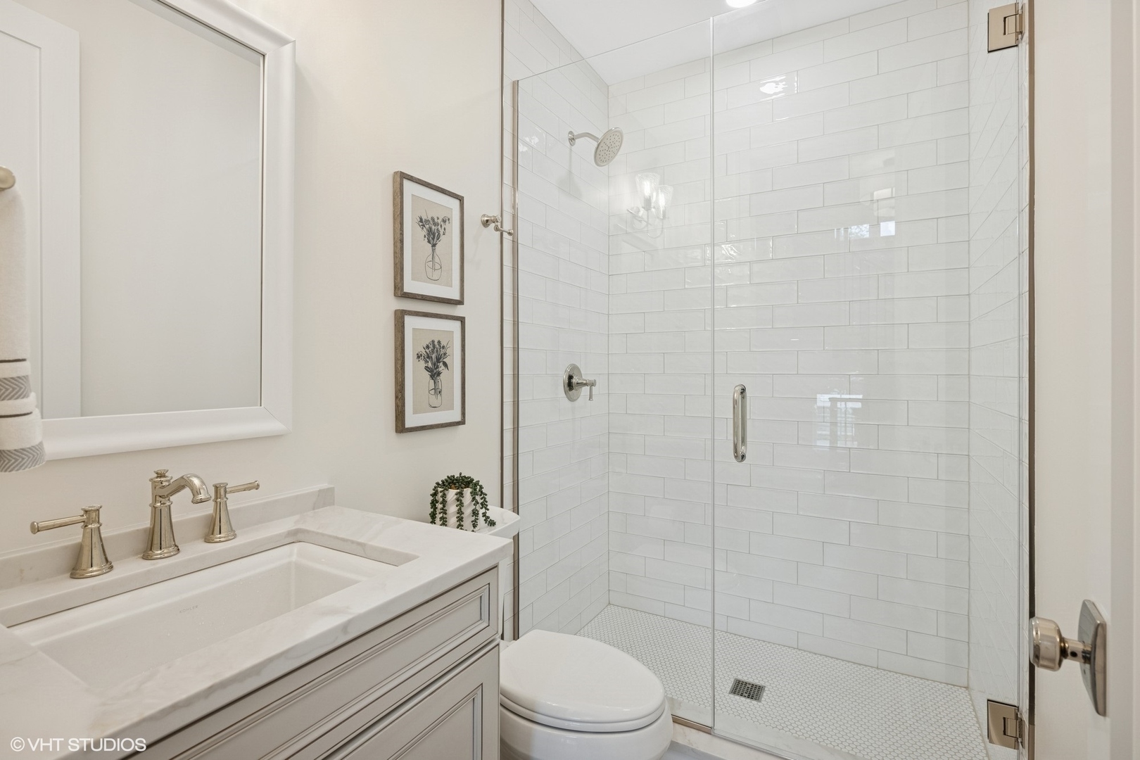 227 South Mitchell Avenue Arlington Heights, IL 60005 - Photo 16 of 40 a bathroom with a granite countertop sink toilet a mirror and shower