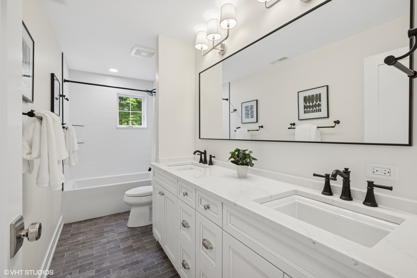 227 South Mitchell Avenue Arlington Heights, IL 60005 - Photo 25 of 40 a bathroom with a granite countertop sink mirror vanity bathtub and a toilet