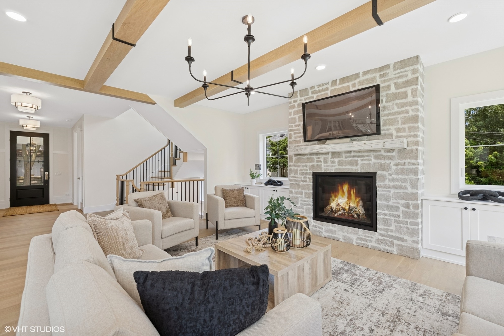 227 South Mitchell Avenue Arlington Heights, IL 60005 - Photo 6 of 40 a living room with furniture a flat screen tv and a fireplace