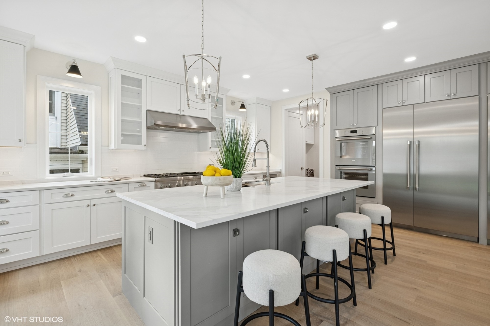 227 South Mitchell Avenue Arlington Heights, IL 60005 - Photo 9 of 40 a kitchen with stainless steel appliances granite countertop a sink a stove a refrigerator and island with wooden floor