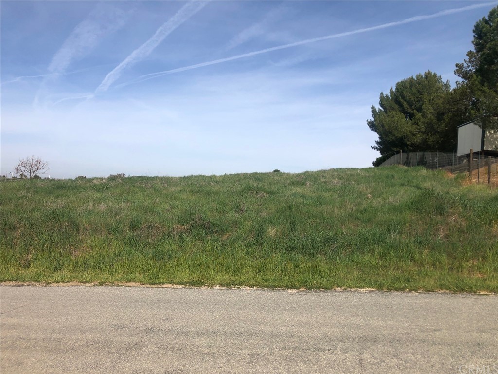 an aerial view of a houses with a yard