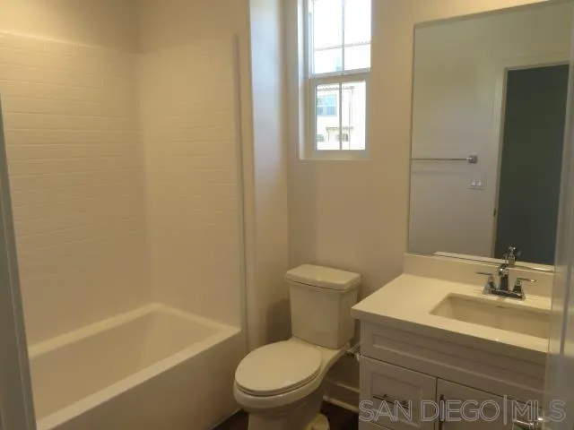 4382 Pacifica Way, Unit 5 Oceanside, CA 92056 - Photo 12 of 35 a bathroom with a sink toilet and bathtub