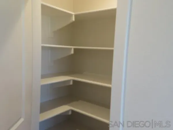 a kitchen with a refrigerator and a sink