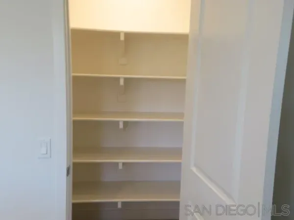 an empty room with closet area