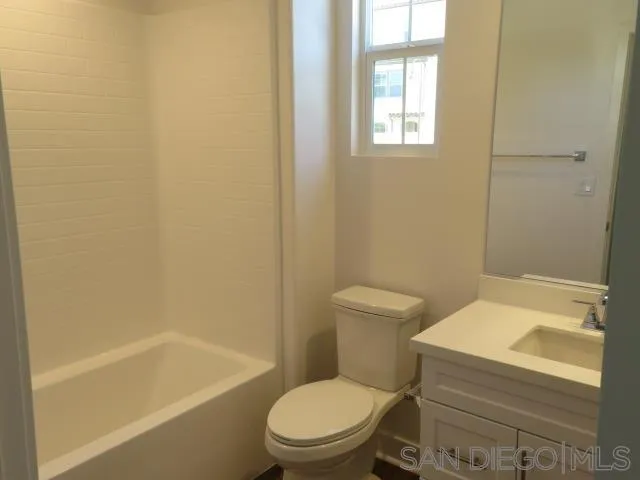 4382 Pacifica Way, Unit 5 Oceanside, CA 92056 - Photo 34 of 35 a white toilet sitting next to a bath tub
