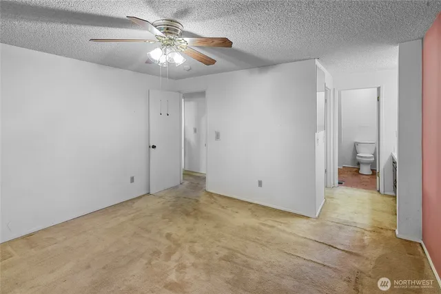 a view of a chandelier fan in a room
