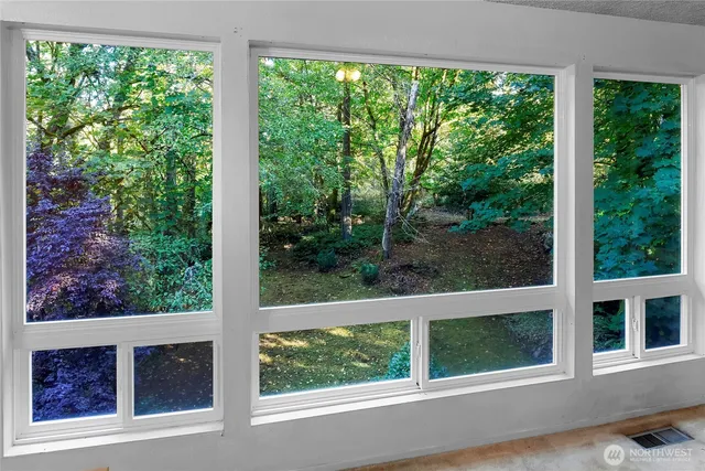 a view of a house with a yard from a window
