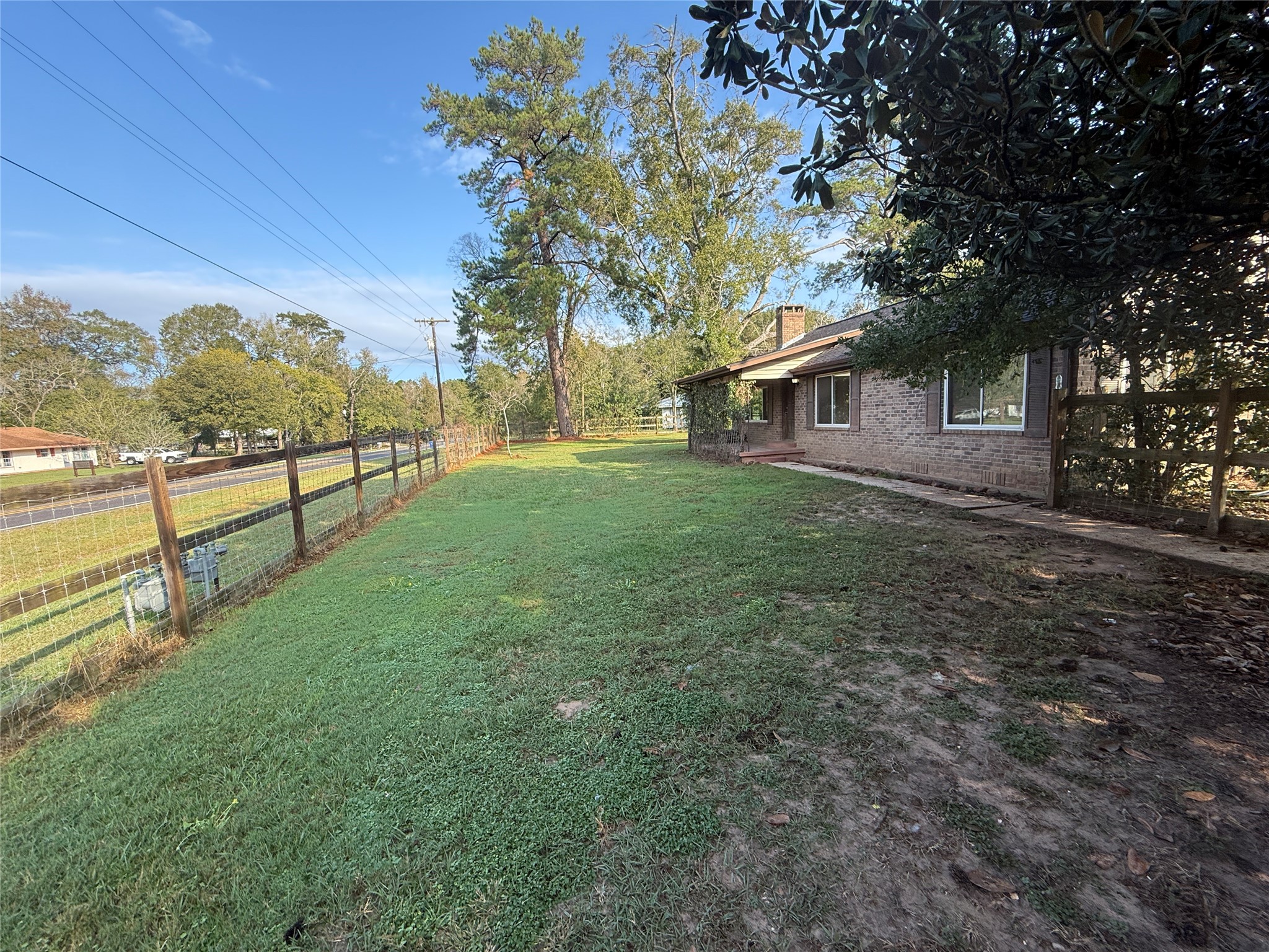 795 Highway 393 Loop Goodrich, TX 77335 - Photo 6 of 22 a view of a house with a yard