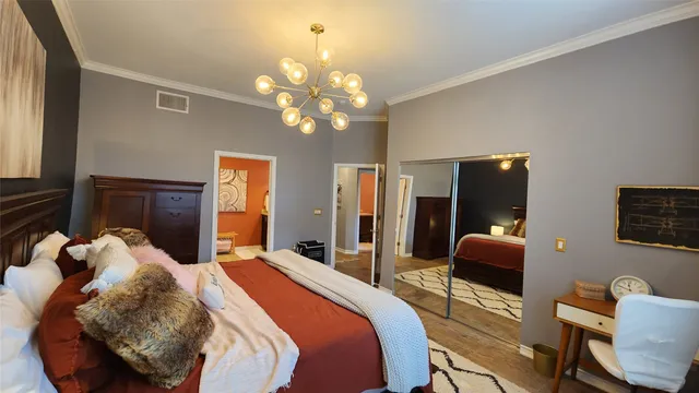 a bed room with a bed window and a chair