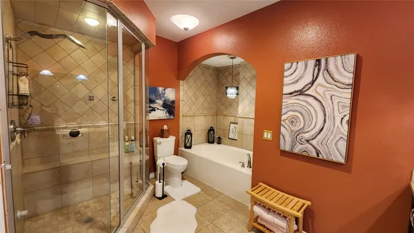 a bathroom with a bathtub and a toilet