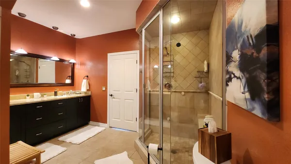 a bathroom with a shower and a toilet