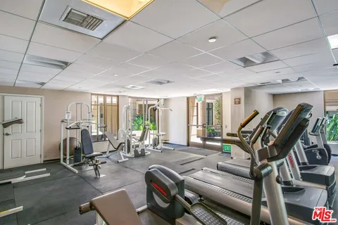 a dining room with a table and chairs