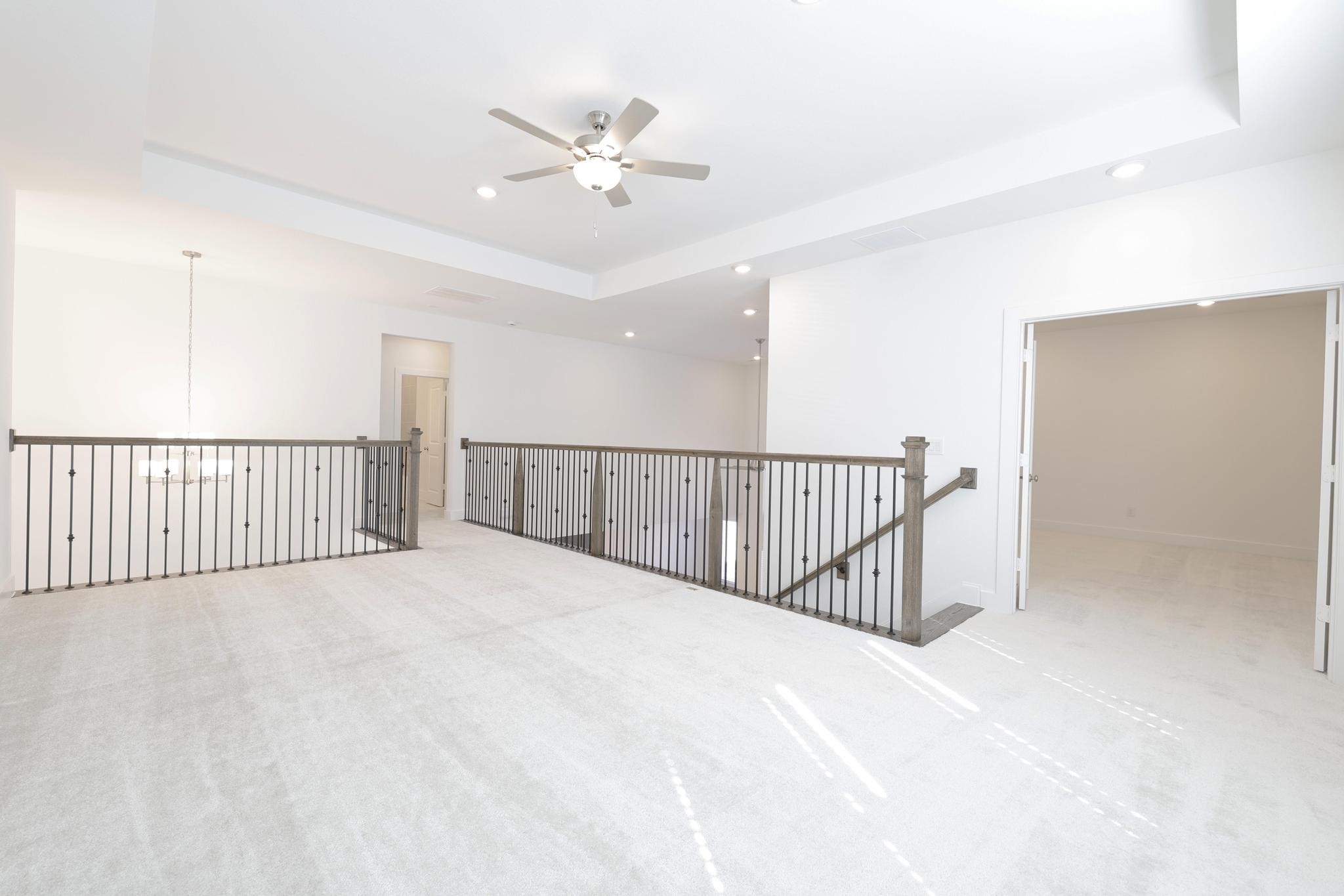 26934 Putnam Bnd Lane Spring, TX 77389 - Photo 15 of 21 a view of a hallway with a chandelier fan