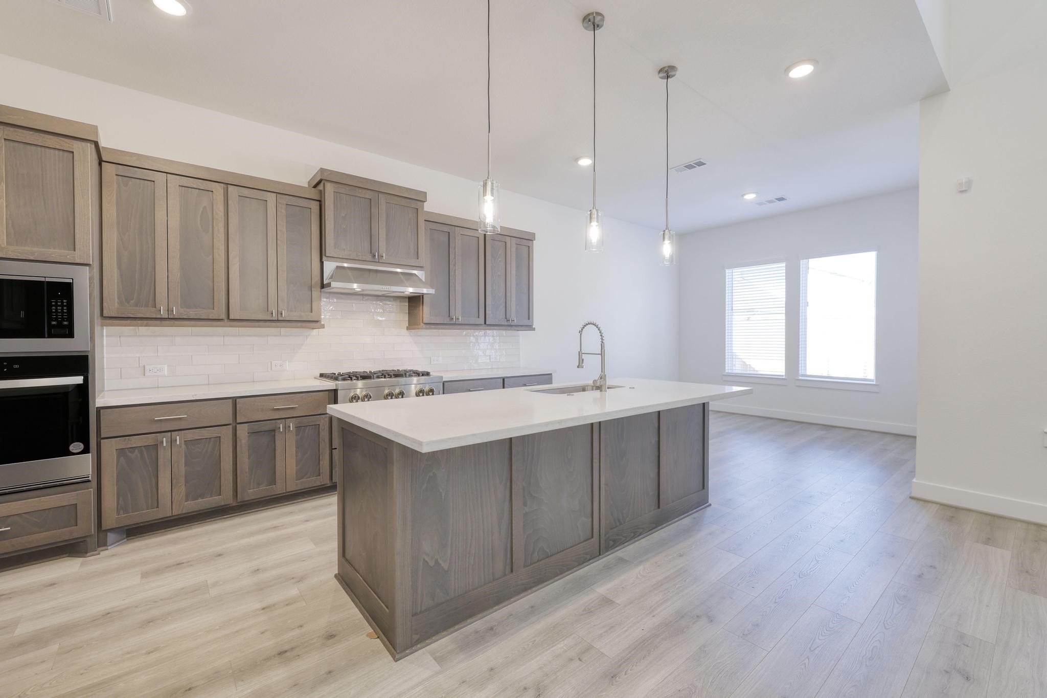 26934 Putnam Bnd Lane Spring, TX 77389 - Photo 10 of 21 a kitchen with a sink window and cabinets