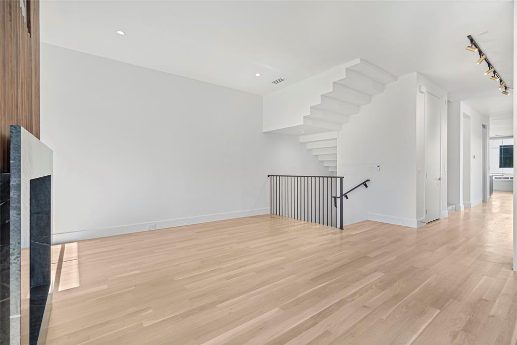 3619 Springbrook Street Dallas, TX 75205 - Photo 13 of 40 a view of an empty room with wooden floor