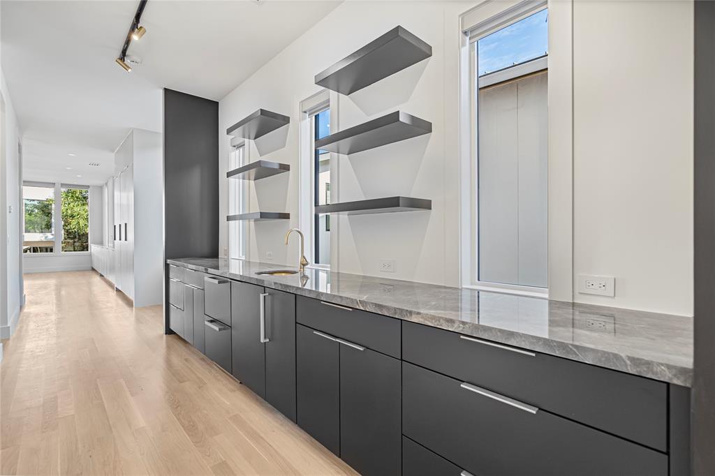 3619 Springbrook Street Dallas, TX 75205 - Photo 15 of 40 a hallway with sink and wooden floor